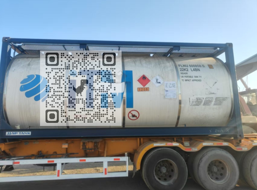 ISO tank containing high-purity n-Heptane, ready for international shipment, with chemical plant in the background.