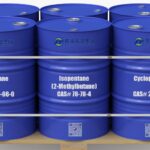 A wooden pallet holding three metal chemical drums labeled n-Pentane (CAS 109-66-0), Isopentane (CAS 78-78-4), and Cyclopentane (CAS 287-92-3). Each drum features clear product labeling and hazard symbols, representing high-purity Pentane isomers used in foam, refrigerant, and solvent applications. Industrial background with clean lighting and a professional laboratory setting.